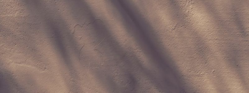 Soft light hitting a wall creating abstract shadows